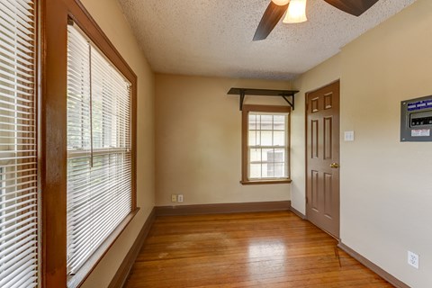 A room with a window and a door.