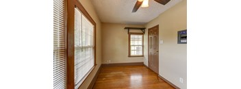 A room with a window and a door.