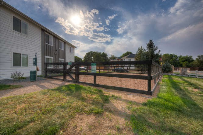 a wooden fence in front of a house