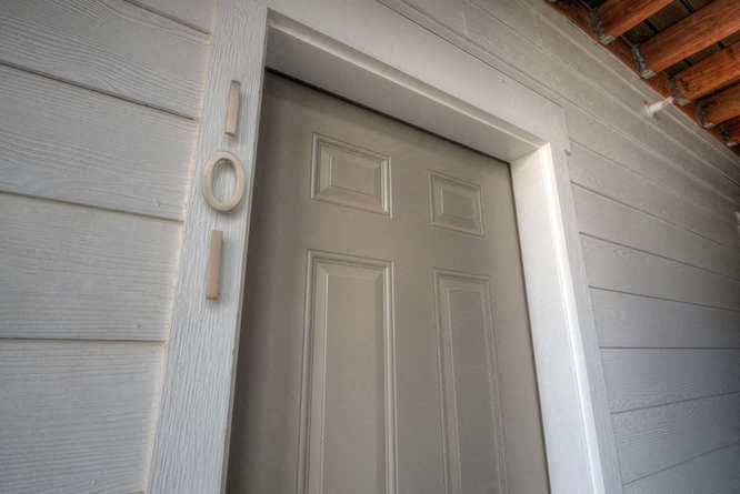 a white door on a white house