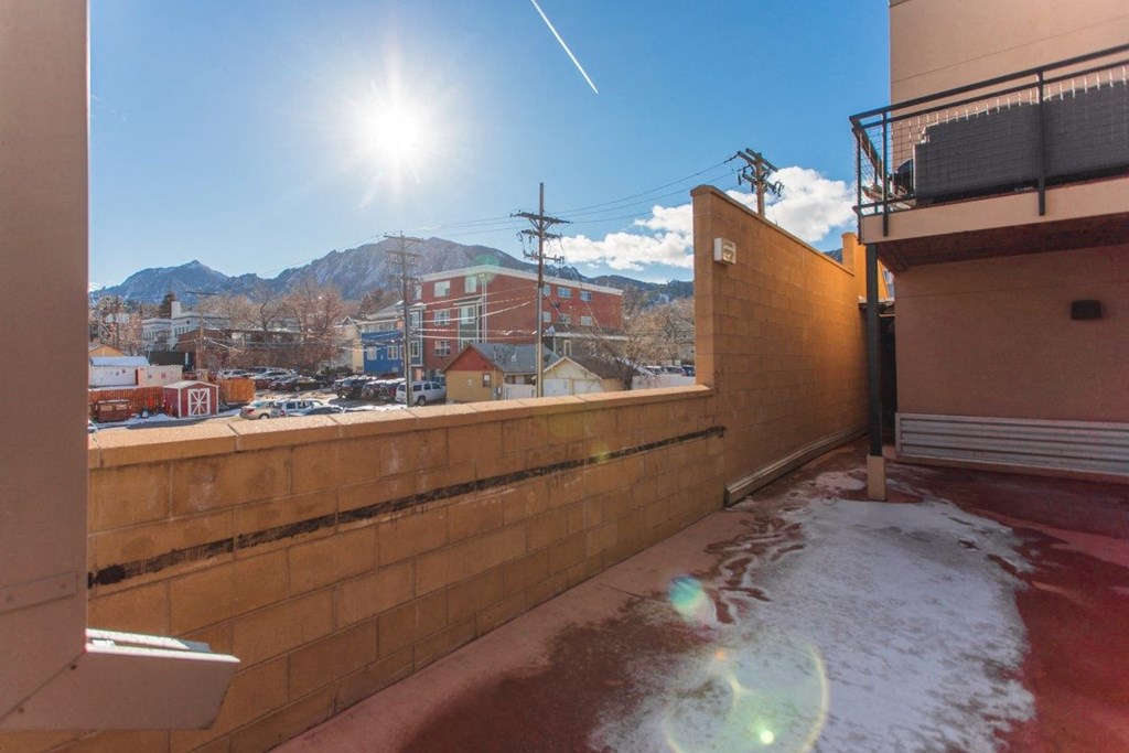 a view of the city from the balcony of a building
