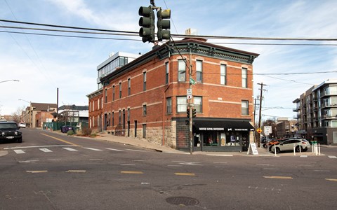 A street view with a traffic light and a building.