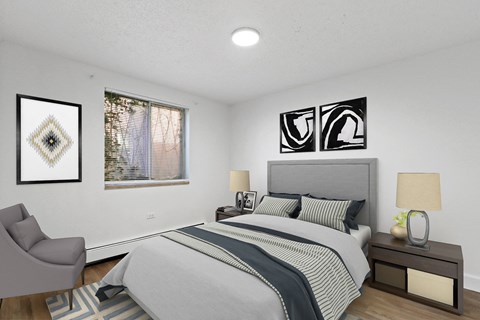 A bedroom with a large bed and a chair.