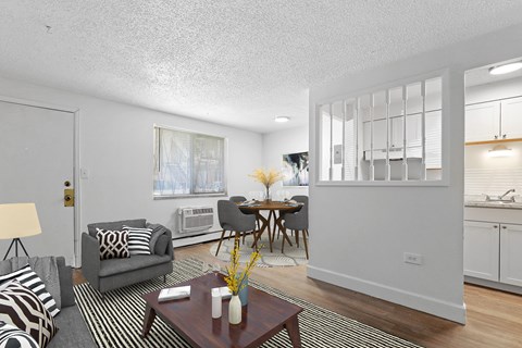 A living room with a grey couch and a coffee table.