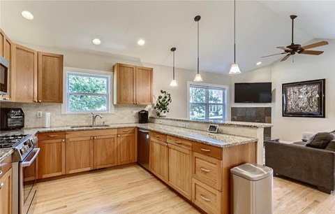 a kitchen with wooden cabinets and a counter top