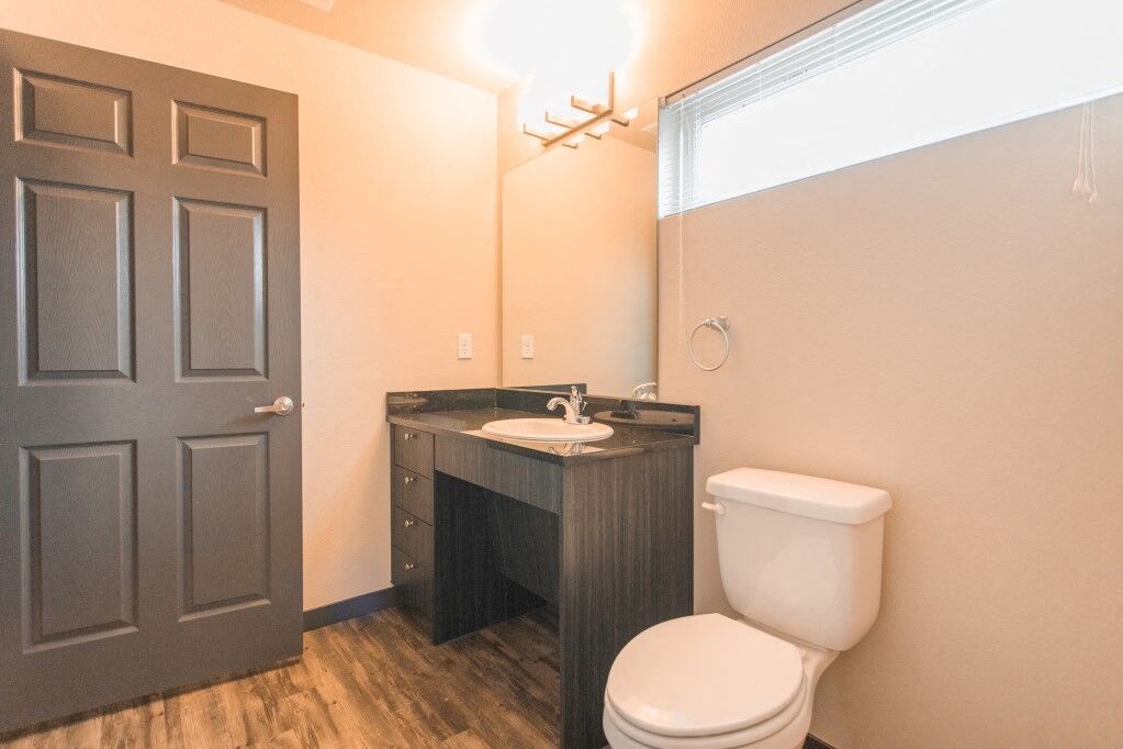 a bathroom with a toilet and a sink