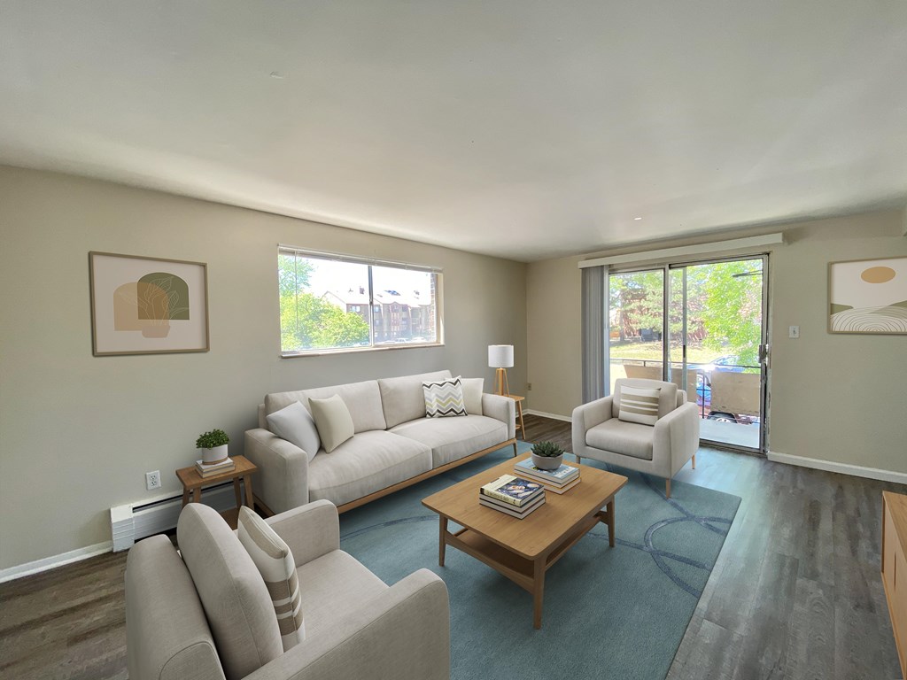A living room with a couch, chair, and coffee table.