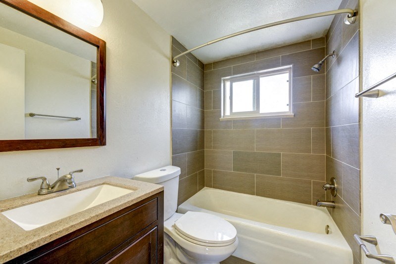 a bathroom with a sink toilet and a bath tub