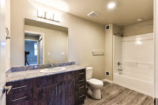 a bathroom with a sink toilet and a shower