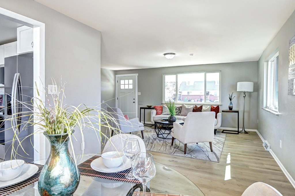 A dining room with a table set for two.