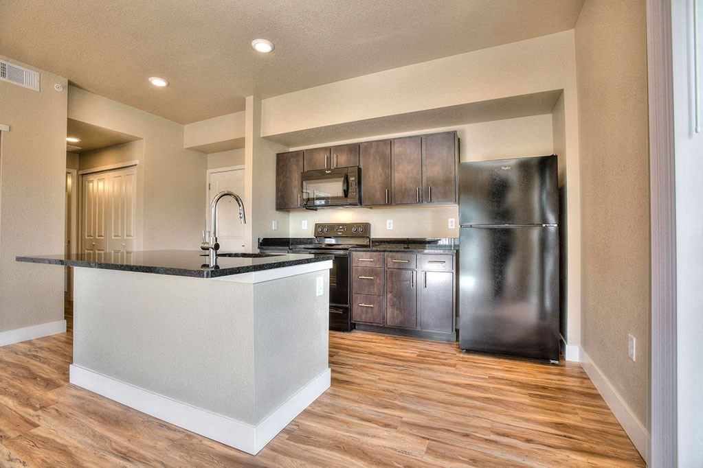 a kitchen with stainless steel appliances and a counter top