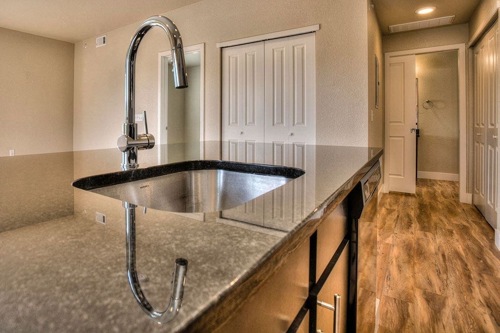 a kitchen with a large sink and a faucet