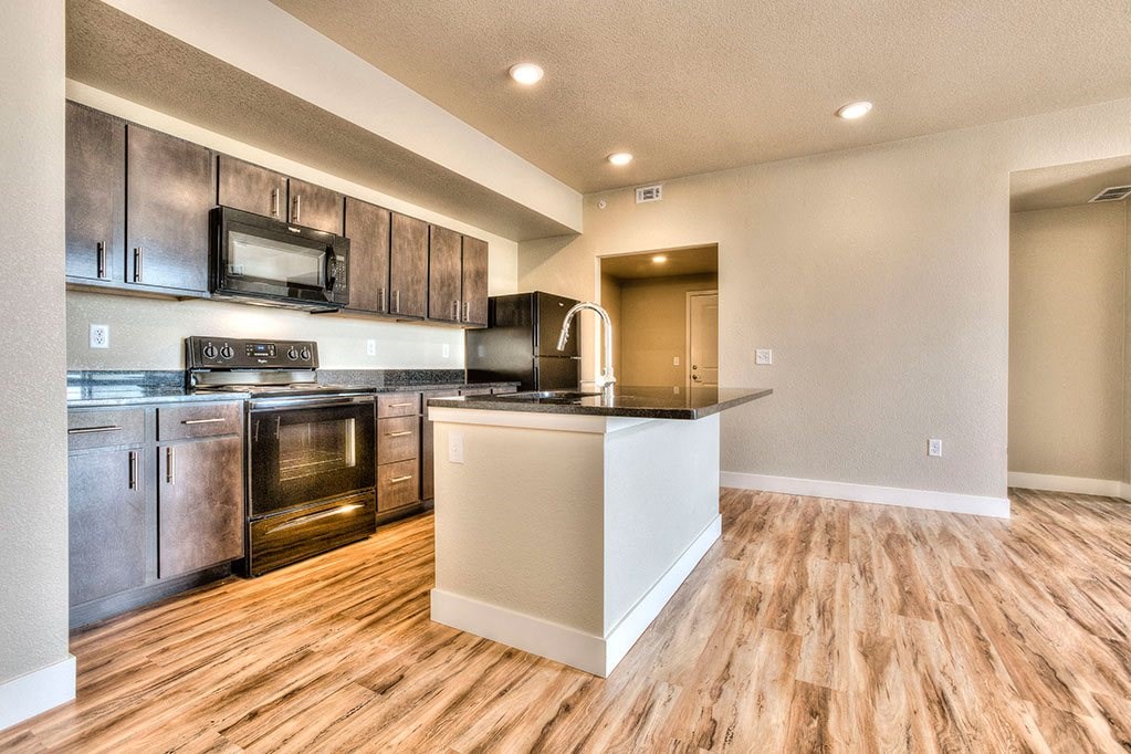 a kitchen with stainless steel appliances and a counter top