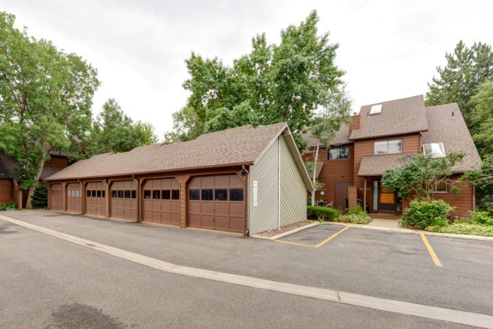 A large garage is attached to a house.