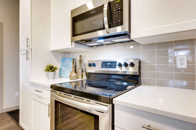 a kitchen with a stove and a microwave