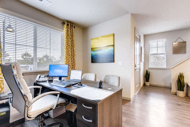 a home office with a desk and a computer
