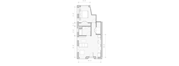 A floor plan of a house with a kitchen, living room, and bathroom.