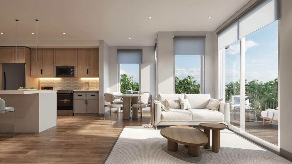 A modern living room with a kitchen area and a large window.