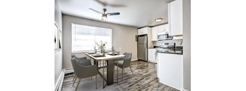 a kitchen and dining area in a 555 waverly unit