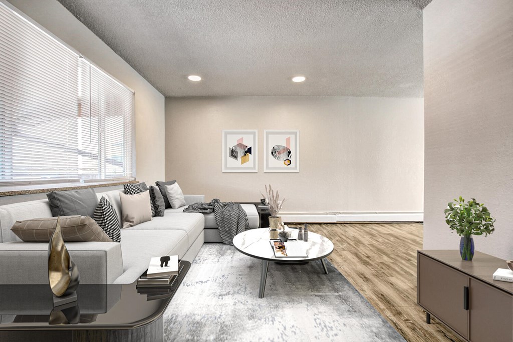 a living room with a white couch and coffee table