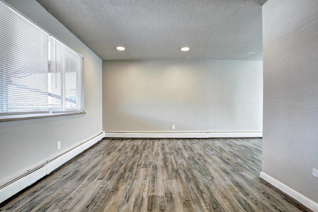 an empty room with a large window