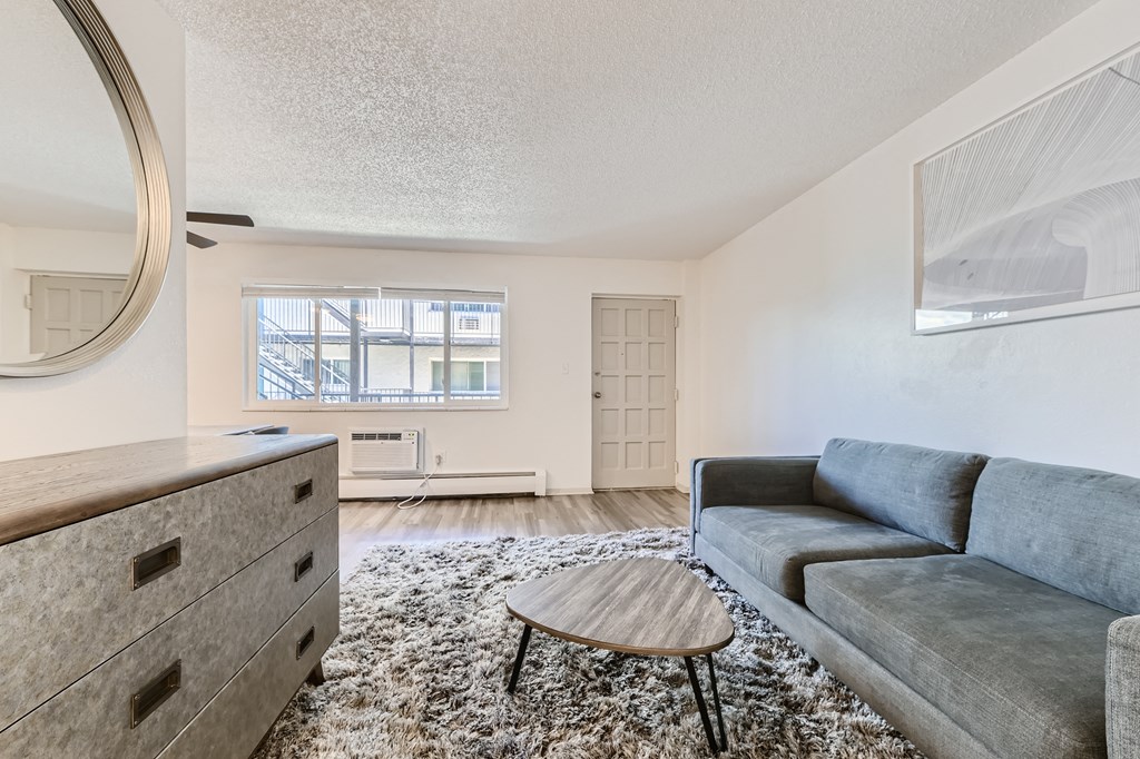 Renovated Living Room View 2 at Postmark at Littleton Apartments, Littleton, Colorado