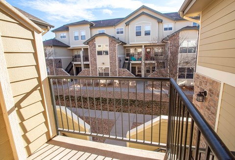 A balcony view of a multi-story residential building.