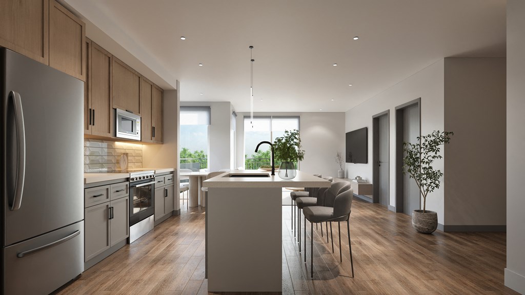 A modern kitchen with wooden cabinets and stainless steel appliances.