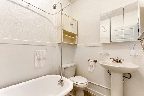 a bathroom with a toilet sink and bathtub