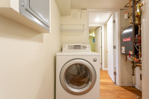a washing machine and dryer in a laundry room with a washer and dry