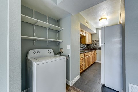 a kitchen and laundry room with a washer and dryer