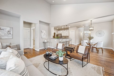 A living room with a white couch and a coffee table.