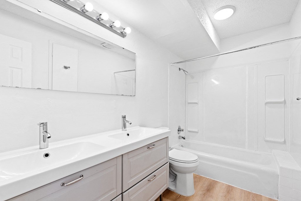 a bathroom sinks and a toilet and a shower