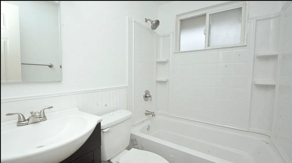 a bathroom with a sink toilet and bathtub