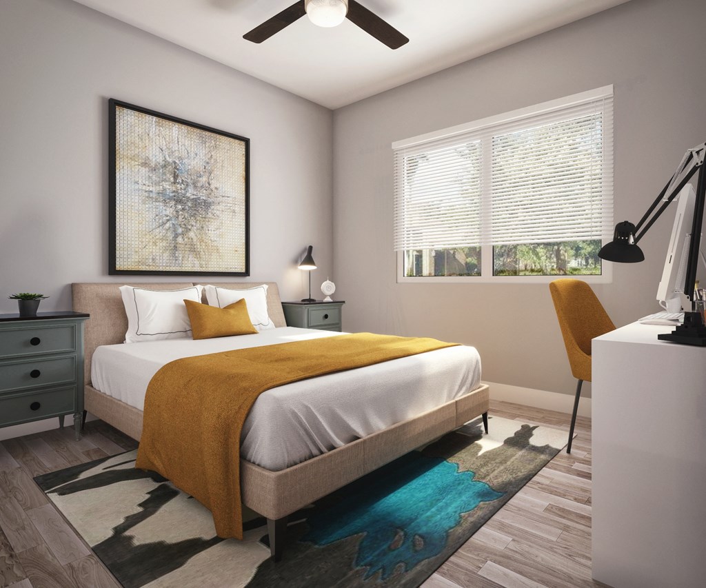 a bedroom with a white bed and a yellow blanket