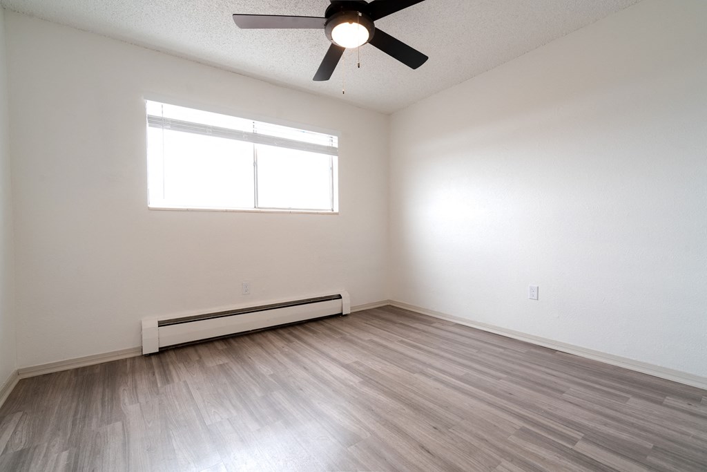 Bedroom with ceiling fan and lightat Postmark at Littleton, Littleton, CO