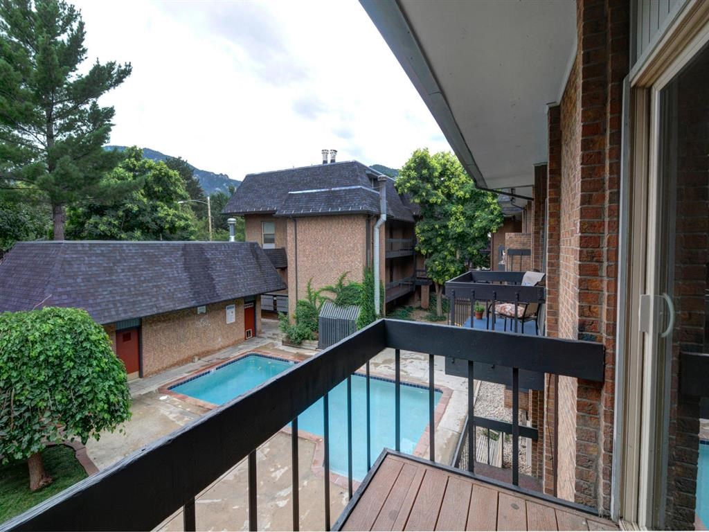 a balcony or terrace with a pool