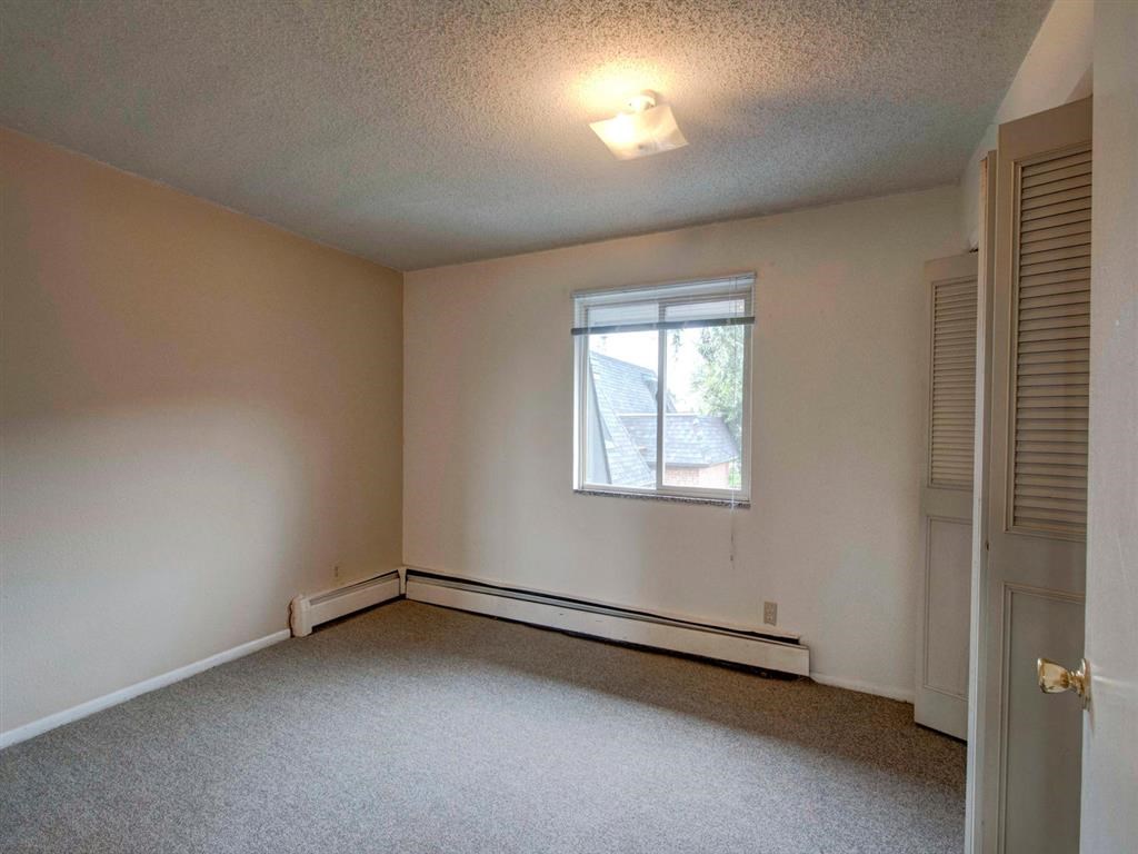 the living room of an empty house with a window