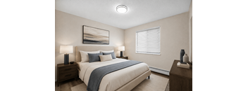 A bedroom with a large bed, two nightstands, and a painting on the wall.