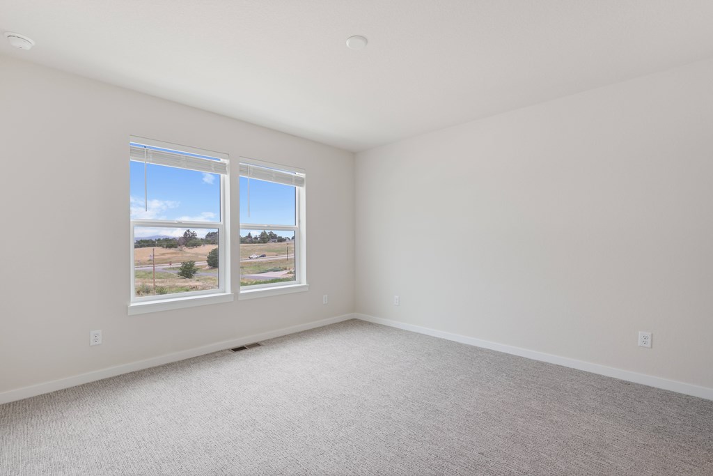 Room with wide windows at The Townhomes at Pine Drive, Parker