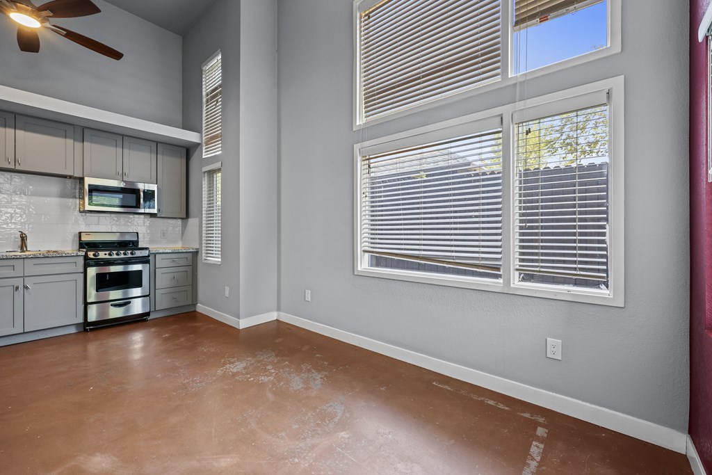 A kitchen with a stove top oven and a microwave.