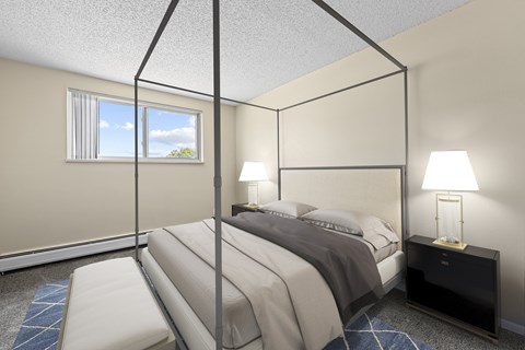 A bedroom with a four poster bed and a window.