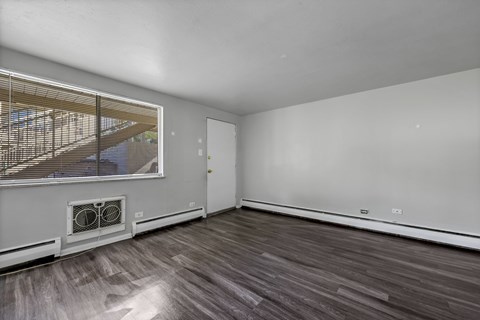 A room with a window and a door.