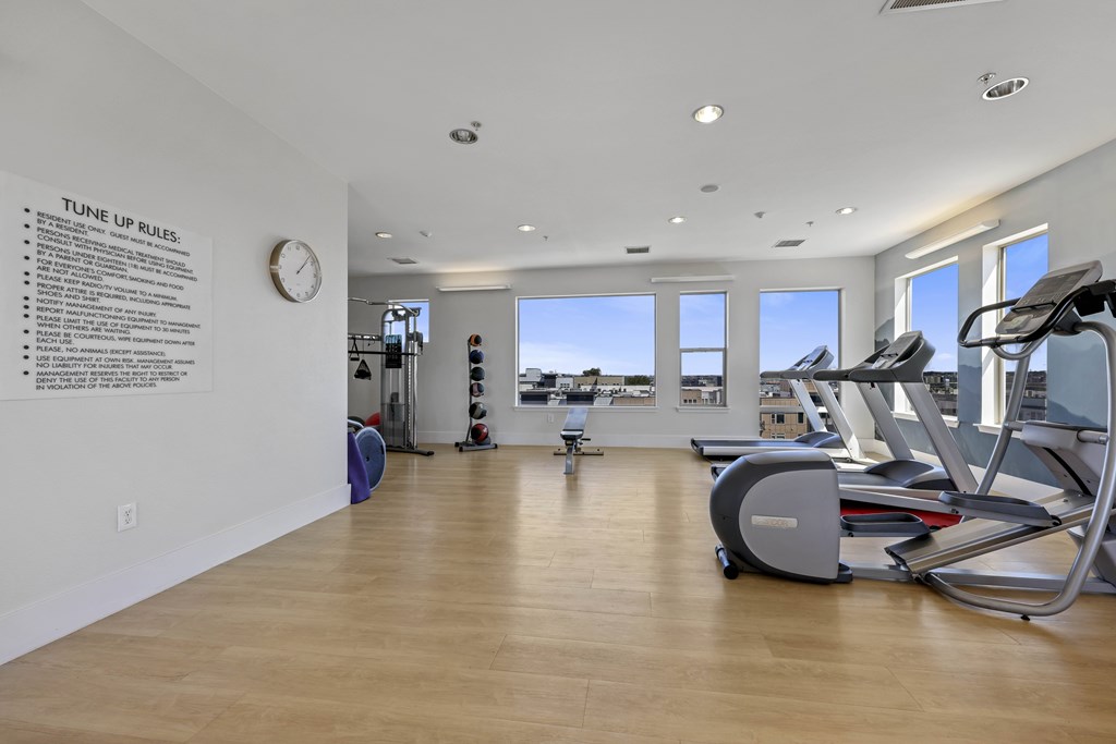 A gym with a sign that says "Tune Up Rules.".