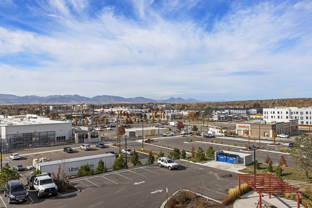 A parking lot with a mountain range in the background.