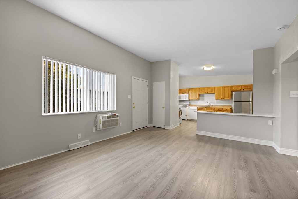 A room with a window and a door.