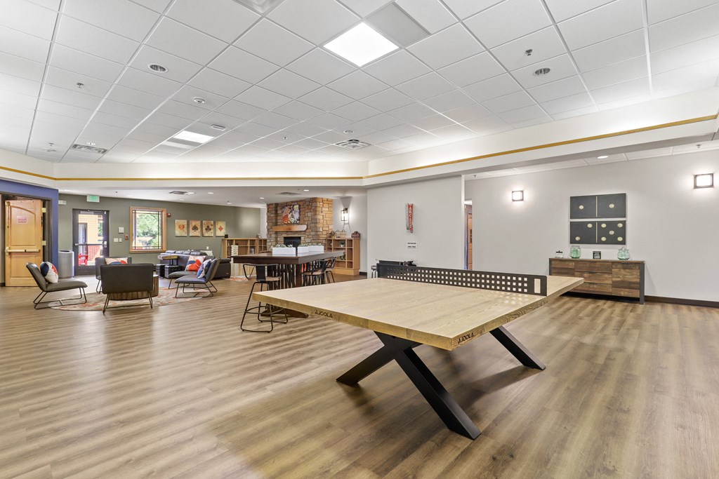 a large room with a ping pong table