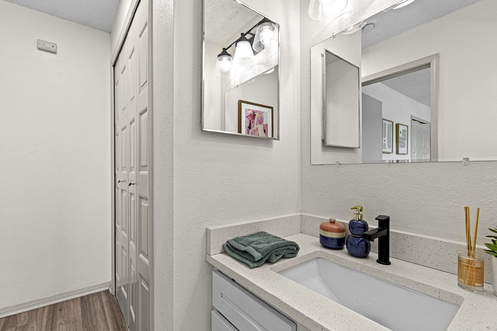 the bathroom of our studio apartment atrium with sink and mirror