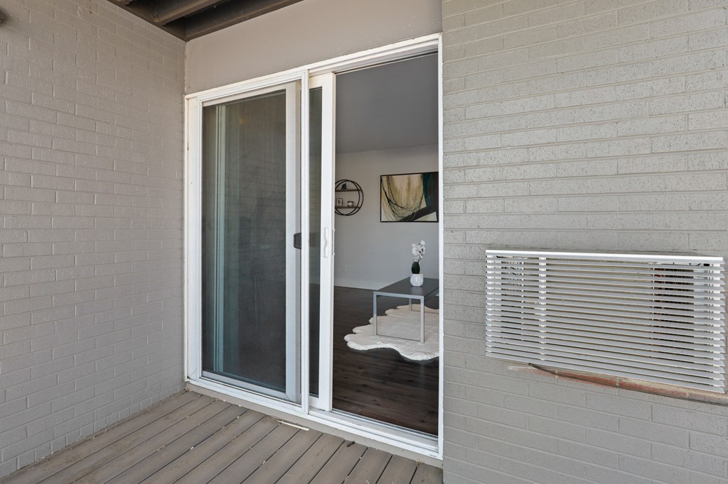 the sliding glass door to the living room is open