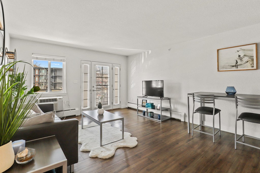 a living room with a couch and a table and a tv